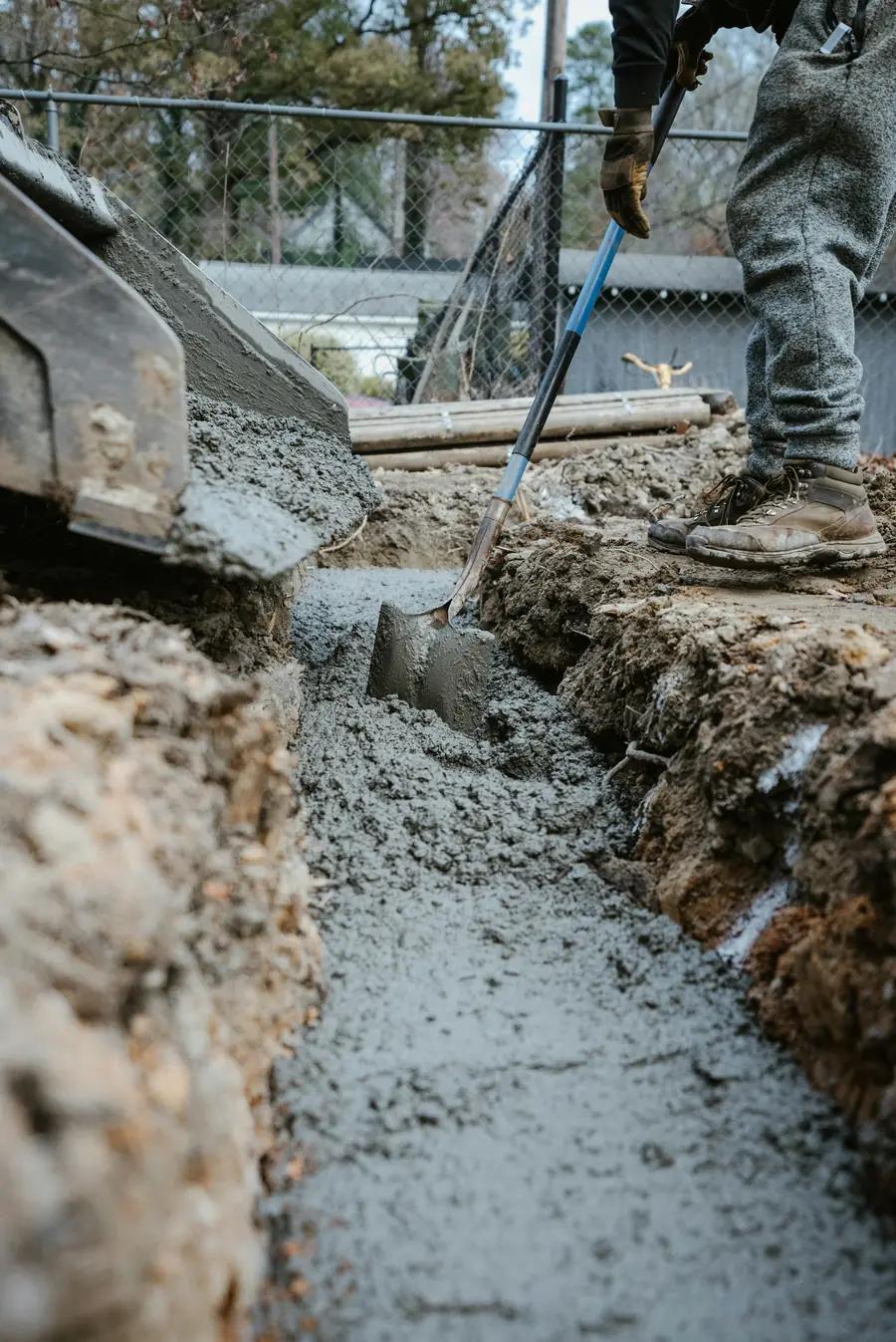Concrete being placed in a foundation trench